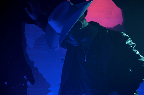 Justin Moore Basks In Neon Light For "Somebody Else Will" Music Video